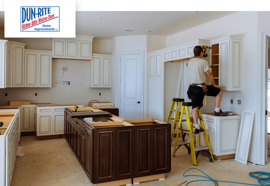 Dunrite contractor installing kitchen cabinets