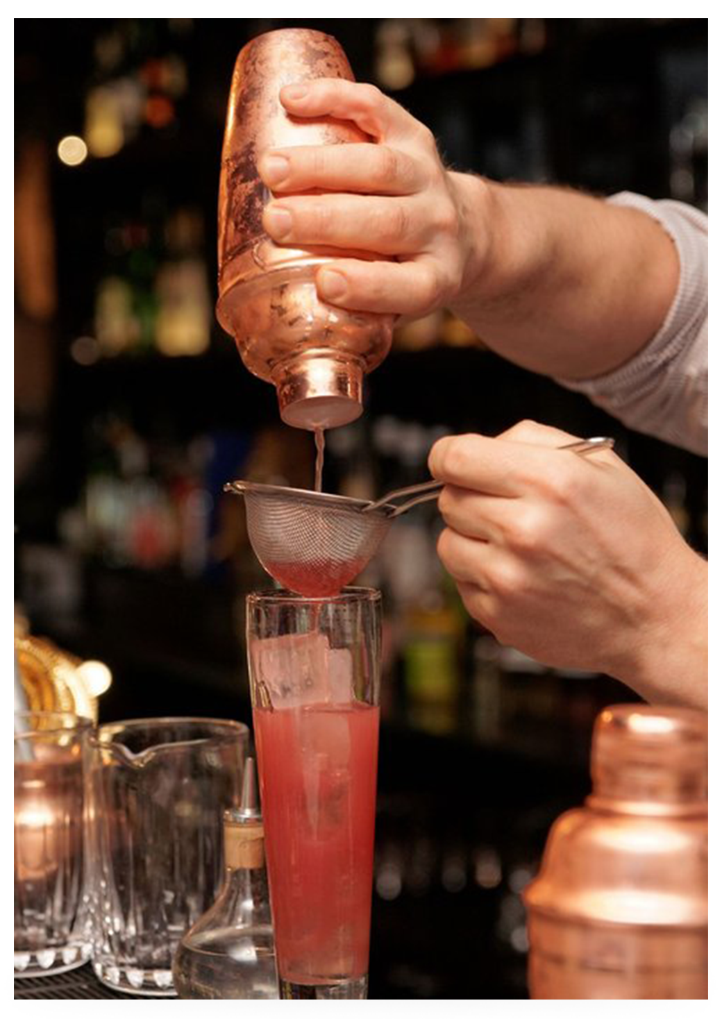 Bartender pouring mixed drink